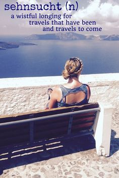 a woman sitting on top of a wooden bench next to the ocean with text overlay