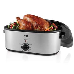 a roaster with a turkey in it on a white background