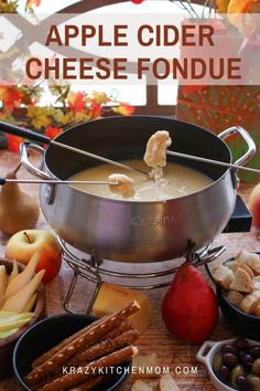 an apple cider cheese fondue is being served