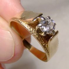 A 14K diamond solitaire engagement ring circa 1960s.  This vintage size 8-1/2 or 8.5 yellow gold and genuine diamond band features a 45 point brilliant cut diamond gem stone (SI-2 clarity, G-H colour).  It is stamped 14K with a maker's mark and it includes a professional independent gemological appraisal for $3400 CAD (approx $2700 USD). A nice affordable and ecofriendly wedding choice!  It weighs 4.7 grams and it is in excellent condition with no chips, cracks, dents, bends, corrosion, losses, damage or repairs other than being a bit out-of-round at the bottom of the band.   Items are vintage or antique and have signs of use as would be expected.  Fedex international insured starts at $129.00 and xpresspost-air insured within Canada starts at $58.00 (tracking and loss insurance is include Vintage Single Diamond Jewelry With Round Band, Vintage Single Diamond Jewelry For Formal Occasions, Vintage Tension Setting Ring Jewelry, Vintage Formal Jewelry With Single Diamond, Vintage Diamond Ring With Tension Setting, Vintage Diamond Solitaire Jewelry, Vintage Round Cut Diamond Ring With Tension Setting, Vintage Tension Setting Ring, Vintage Jewelry With Tension Setting As A Gift