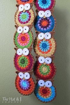 multicolored crocheted objects hanging on the wall