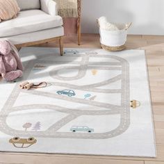 a child's play rug with cars and trucks on it in a living room