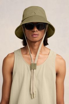 sage green cotton gabardine weave signature Ami de Coeur monogram motif eyelet detailing flat crown dropped wide brim drawstring fastening Bucket Hat With String, Beach Day Essentials, M Hat, Designer Caps, Caps For Men, Ami Paris, La Pointe, Trendy Accessories, Dress With Cardigan