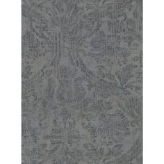 a gray rug with an intricate design on the front and back side, in shades of blue