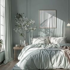 a bed with white sheets and pillows in a bedroom next to a window filled with plants