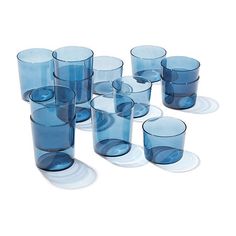 a group of blue glasses sitting on top of each other