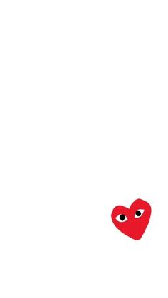 a red heart with two eyes is in the air on a white background that appears to be floating