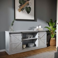 a living room with a gray wall and wooden floors