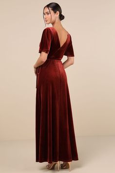 a woman in a red velvet dress