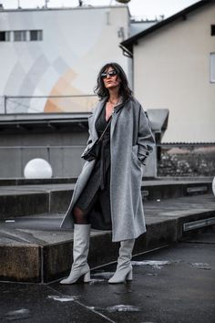 Whoever claimed that a knit wrap dress must be dull clearly hasn't explored its full potential! | How To Wear A Knit Wrap Dress: Wrap It Up & Unleash Your Style | Grey Knit Wrap Dress Winter Outfits, White Boots, Black Tights Black Wrap Dress Boots, Gray Wrap Dress, Black Wrap Sweater Dress, Grey Wrap Sweater Dress