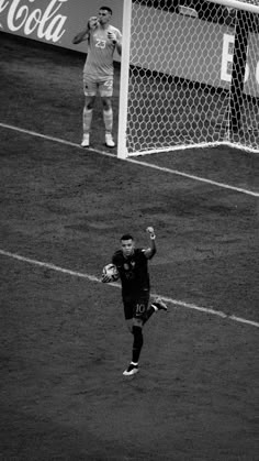 the soccer player is getting ready to kick the ball into the goalie's net