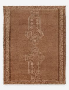 a brown rug with an intricate design on it