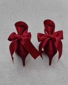 two red bows tied together on top of each other