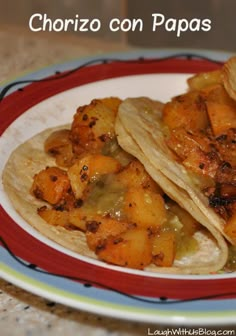 two tacos are sitting on a red and white plate with pineapples in the background