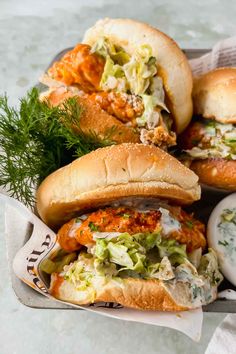 a basket filled with lots of different types of sandwiches