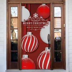 a red and white christmas door with ornaments on it