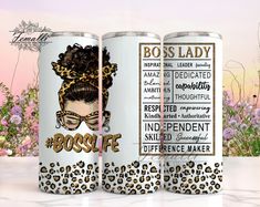 two white cans with leopard print on them and the words boss lady are next to each other