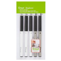 four cricut explore markers in black and white ink, each with an eraser