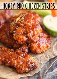 honey bbq chicken strips on a piece of wax paper with an apple in the background