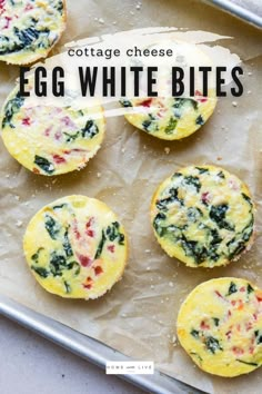 egg white bites with spinach and cheese in the middle on a baking sheet, ready to be eaten