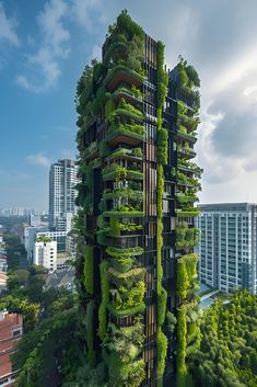 a tall building covered in lots of green plants