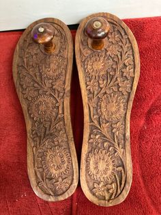 Hand Carved Wooden Khadau , Wooden Sandals Handcrafted Traditional Khadau About this item Hand selected special paduka with several auspicious symbols of Shankh, Star, Mace, Sun, Flowers. Very fine hand carving on wood. Selected limited edition. Dimensions of Paduka: 3.0 inches (H) x3 1/2 inches (W) X 10 1/2 inches (L) x 1 inch (thicknessMATERIAL: Wood ORIGIN: Handcrafted in India CARE: Clean with a soft, dry cloth. And, keep the Paduka dry; do not get wet. Made In: India Handmade Wooden Khadau Paduka Sandals, Carving On Wood, Worship Room, Indian Footwear, Birthday Wishes For Girlfriend, Double Bed Designs, Wooden Sandals, Sun Flowers, Art Glass Vase