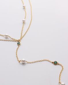 Pearl & Emerald Lariat Necklace Featuring exquisite pearls and vibrant emeralds, this lariat necklace will add elegance and sophistication to any outfit. DETAILS: 14k Gold Vermeil Synthetic pearl and emerald stones Double layered 15" with a 2" extender Lobster clasp Resort Jewelry, Backpack Gift, Beauty Clothes, Emerald Stone, Lariat Necklace, Fine Jewellery Earrings, Outfit Details, Ring Bracelet, Christmas List