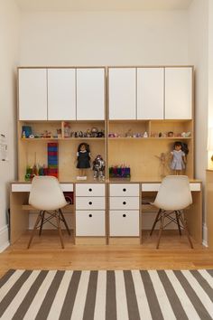 two children's desks in front of a wall with the words, the symmetrical twin desk