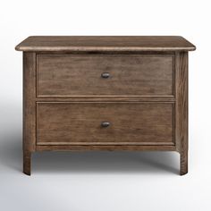 a wooden nightstand with two drawers on it's sides, against a white background