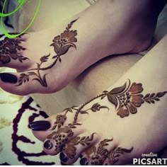 the feet are decorated with flowers and leaves