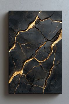 a black and gold painting on the wall