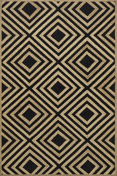 a black and gold area rug with an abstract design