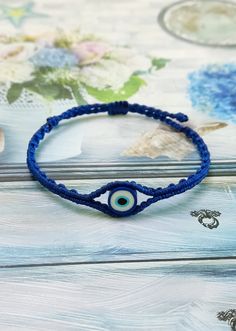 an evil eye beaded bracelet on top of a table