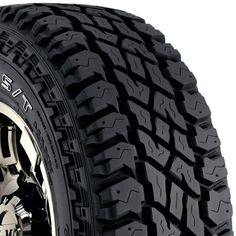 an all terrain tire on a white background