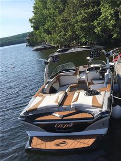 a boat is parked in the water next to another boat