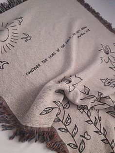 a white blanket with black writing on it