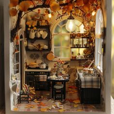 a doll house with an open kitchen and dining room in the background, all decorated for fall