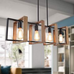 the light fixture is made from wood and has five bulbs hanging from it's sides