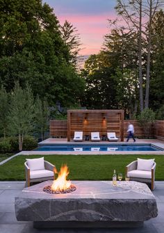 a fire pit in the middle of a backyard