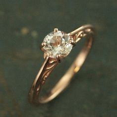 an engagement ring with a white diamond in the center