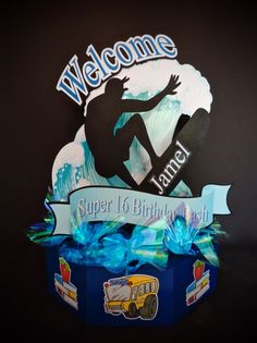 the welcome sign is displayed in front of a black background with blue ribbon and an image of a surfer