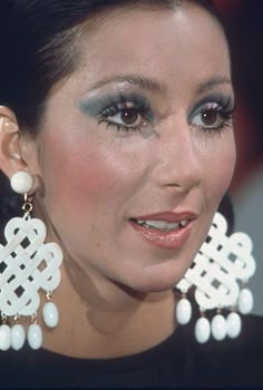 Cher 80s Makeup, Cher Make Up 70s, 70s Disco Photos, Cher 1970s Makeup, 70s Earrings Vintage, Cher Makeup 70s, Cher 70s Makeup, Cher Earrings, Cher Makeup