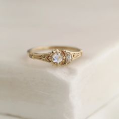 a close up of a ring on a white surface