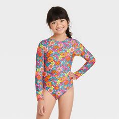 This 'Retro Row' Rash Guard Swimsuit from Cat & Jack™️ will instantly brighten your child's swimwear. Made from a soft and stretchy fabric for comfy movement in and out of the water, this rash guard swimsuit boasts a UPF 50+ rating that helps keep your kid shielded from the sun's UV rays. The long-sleeve rash guard is adorned with a seamless floral print in yellow, orange, light pink and light blue hues on a bright pink background for a stunning look. Plus, it's designed with a half-length back Rashguard Swimsuit, Long Sleeve Rashguard, Girls Tie, Orange Light, Swimwear Sets, Cute Swimsuits, Kids Swimwear, Kids Outfits Girls, Swimwear Fashion