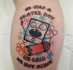 a cartoon character on the side of a woman's leg with words written below it