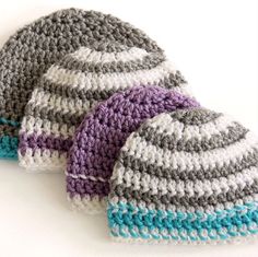 three crocheted hats sitting next to each other