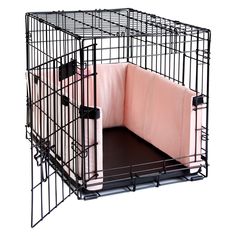 a black dog cage with a pink blanket in it