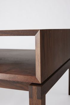 a close up of a wooden shelf on a white background with no people around it