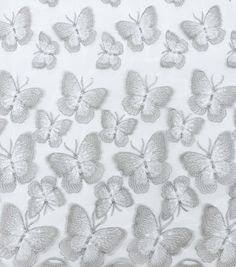 a white background with silver butterflies on it