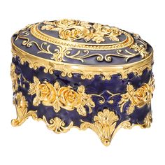 an ornate blue and gold box with roses on the lid is sitting in front of a white background